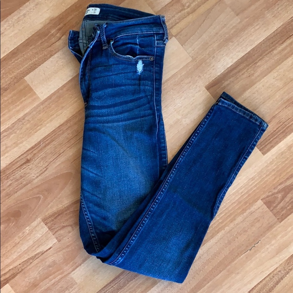High-rise super skinny medium-wash jeans